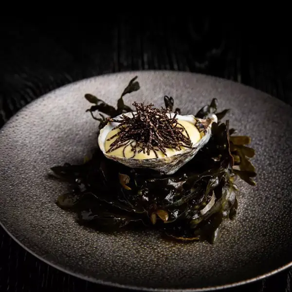 Plated French dish at L'Abattoir, a Michelin-recommended restaurant in Vancouver